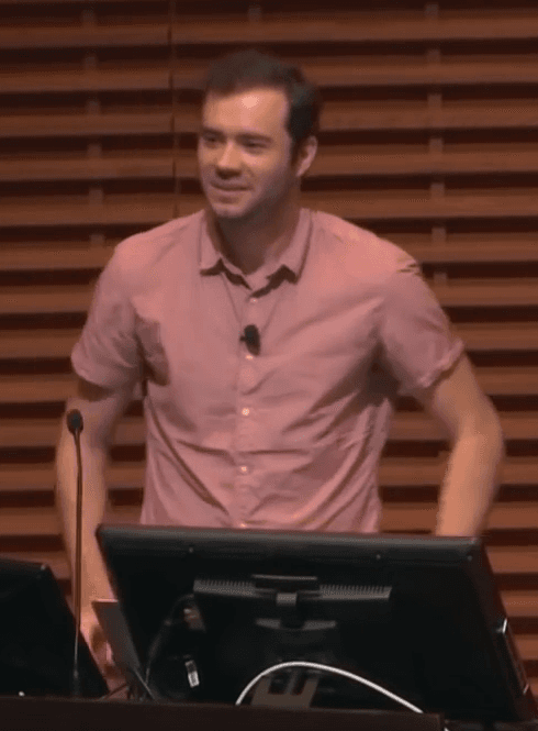 Portrait of Andrej Karpathy taken during his earlier tenure at OpenAI, shown against a plain background.