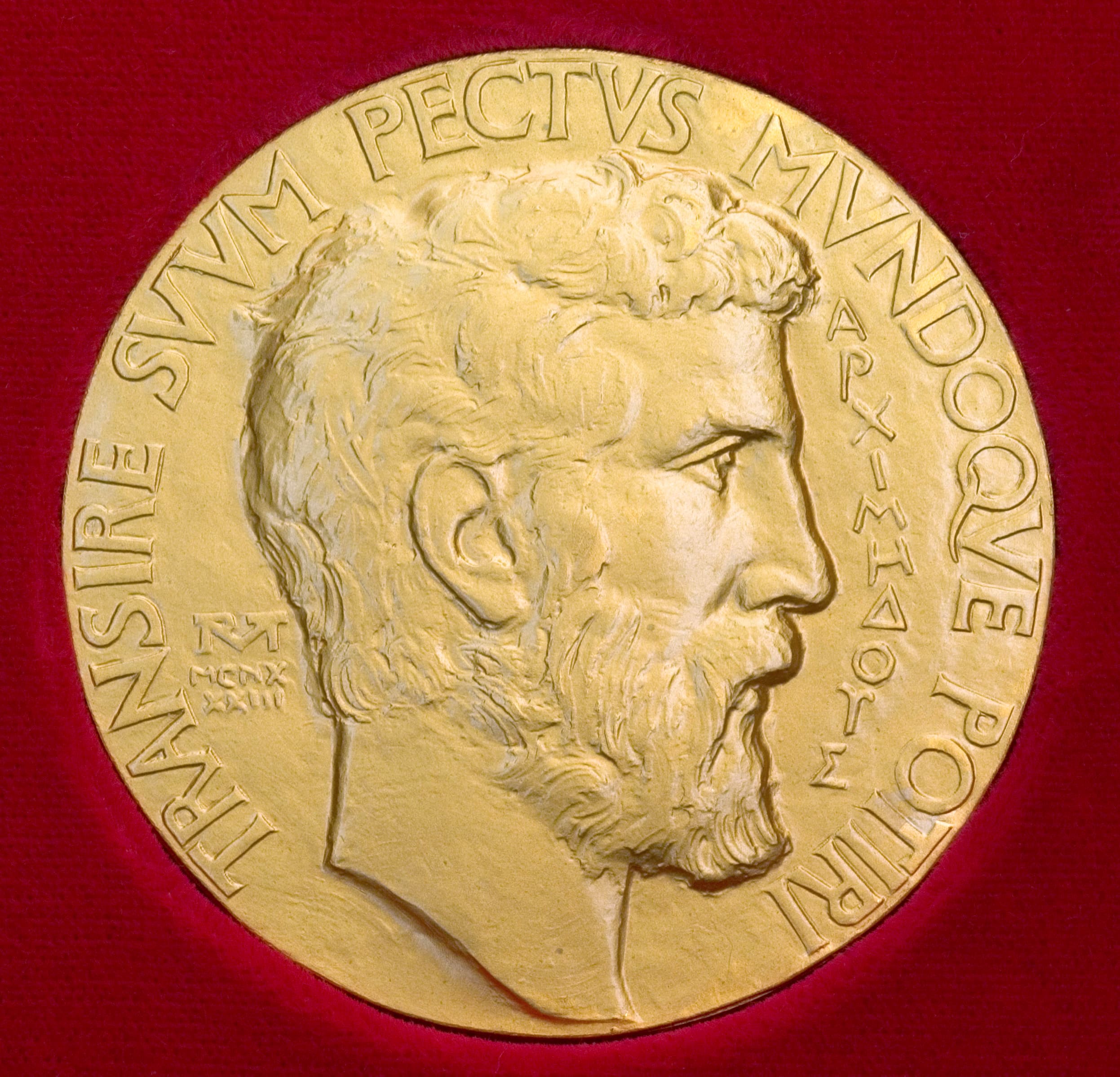 The obverse of the Fields Medal, showing the profile of Archimedes in high relief with the Latin inscription "TRANSIRE SUUM PECTUS MUNDOQUE POTIRI" — "to rise above oneself and grasp the world." The medal is awarded every four years by the International Mathematical Union to mathematicians under 40 and is the highest honour in the discipline.