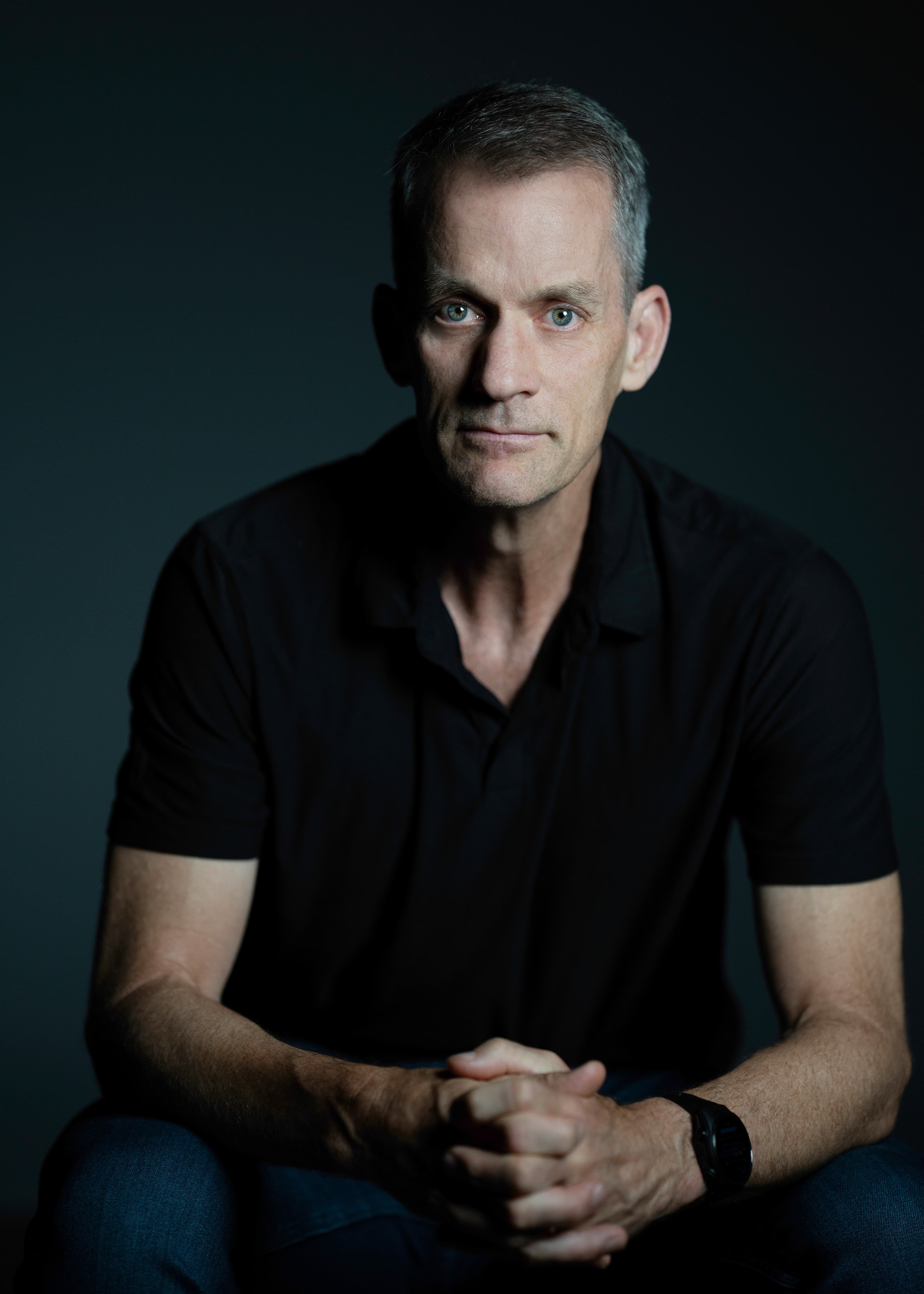 Colour portrait of Jeff Dean taken on August 20, 2025 in Google's Building 43 in Mountain View, California, by photographer Christopher P. Michel. Dean served as Google's Chief Scientist and had been at the company for nearly 27 years when, on August 5, 2026, he and three co-founders — Sanjay Ghemawat, Oriol Vinyals, and Quoc Le — announced the launch of Discovery Loop, a Delaware public benefit corporation aimed at automating the scientific-research loop through AI. Alphabet joined Radical Ventures and Khosla Ventures as investors, and Google Cloud is the compute provider for the new company's first year.