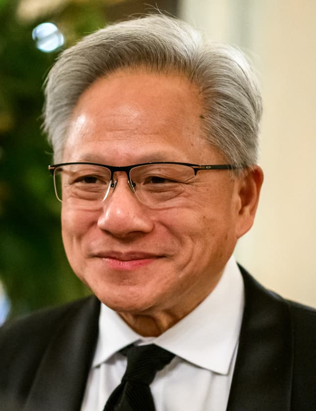 Colour portrait photograph of Jen-Hsun "Jensen" Huang, co-founder and chief executive officer of Nvidia Corporation, taken in 2025. On Monday August 10, 2026, Nvidia signed a memorandum of understanding with six Wall Street firms — Apollo Global Management, BlackRock, Blackstone, Brookfield Asset Management, Goldman Sachs and KKR — to establish an independent compute-financing platform designed to mobilise more than 500 billion US dollars in third-party capital for AI infrastructure. The mechanism at the centre of the arrangement is a Nvidia-provided residual-value guarantee of up to 25 percent for individual project financings, reviewed case by case. BlackRock chief executive Larry Fink described the initiative as "the next future for financial engineering" and drew a direct comparison to the emergence of mortgage-backed securities in the 1970s. Jensen Huang characterised Nvidia chips as "an investable asset class" and argued the useful economic life of a GPU stretches close to a decade, pushing back on short-seller Michael Burry's public warnings about hyperscaler depreciation schedules. Nvidia stock closed down between 1.4 and 2.9 percent on the day of the announcement.