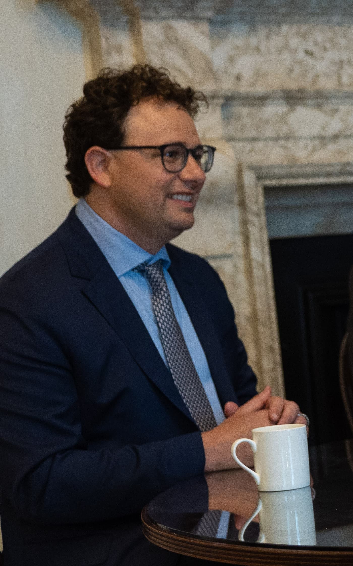 A colour photograph of Anthropic CEO Dario Amodei at 10 Downing Street on 24 May 2023, seated during a working meeting with UK Prime Minister Rishi Sunak, DeepMind CEO Demis Hassabis and OpenAI CEO Sam Altman. Amodei is the founder and chief executive of Anthropic, the company that shipped the Fable 5 frontier model in mid-July 2026 and whose corporate customers, on the record of Ramp's August 12 2026 AI Index, allocated six percent of Anthropic-purchased tokens and 11.4 percent of Anthropic-directed dollars to that flagship in its first month on the market. Ramp Lead Economist Ara Kharazian described the number as a new upper bound on business willingness to pay for frontier AI. OpenAI's flagship GPT-5.6 Sol pulled twenty-five percent of OpenAI tokens and twenty-three percent of OpenAI spend across the same period.