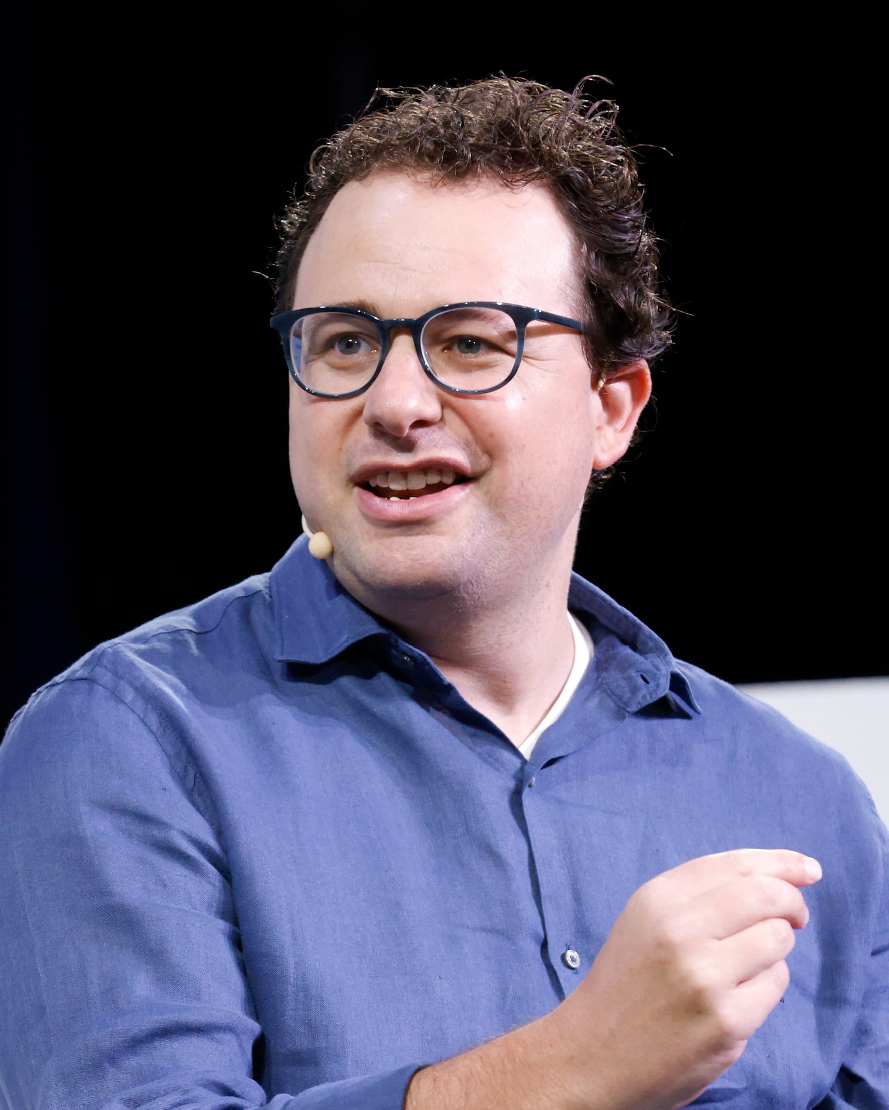 Portrait of Dario Amodei, CEO and co-founder of Anthropic, speaking at TechCrunch Disrupt 2023 in September 2023. On Wednesday October 14, 2026, Anthropic walked a room of institutional investors in San Francisco through the first full quarter of financials it has ever shared with outsiders. Q3 revenue reached $16.8 billion, a 45 percent jump from the previous quarter, but a sharp deceleration from the 140 percent sequential growth Q2 had posted against Q1. The pitch was staged ahead of a planned November IPO at a valuation banker-floated at up to $2 trillion. Several load-bearing details were missing from the deck — notably the annualized run-rate metric Anthropic had been quoting through the first half of the year.