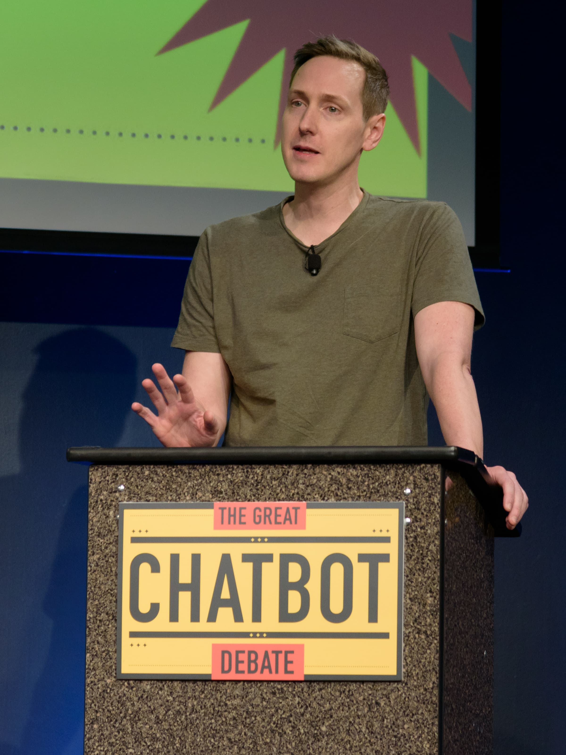 Colour photograph of Sébastien Bubeck, French-American mathematician and machine-learning researcher, on stage at the Computer History Museum in Mountain View, California on March 25, 2025, taking part in a public debate called The Great Chatbot Debate. Bubeck joined OpenAI in October 2024 after a decade at Microsoft Research where he ran the Machine Learning Foundations group and co-authored the 2023 Sparks of Artificial General Intelligence paper on GPT-4. On Saturday August 1, 2026 he published, on his personal account and via OpenAI's news page Ten advances in mathematics and theoretical computer science, ten previously open problems in areas ranging from von Neumann algebras and group theory to sphere-packing and circuit complexity, each solved by an internal OpenAI model tentatively named Astra and each accompanied by a Lean formal certificate and a chain-of-thought walkthrough. The total inference cost of finding all ten solutions, at Sol API rates, was roughly two thousand dollars.